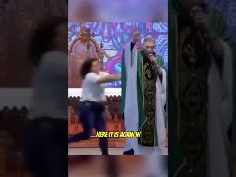 Lady pushes Catholic Priest off a stage while preaching 😲 #shorts